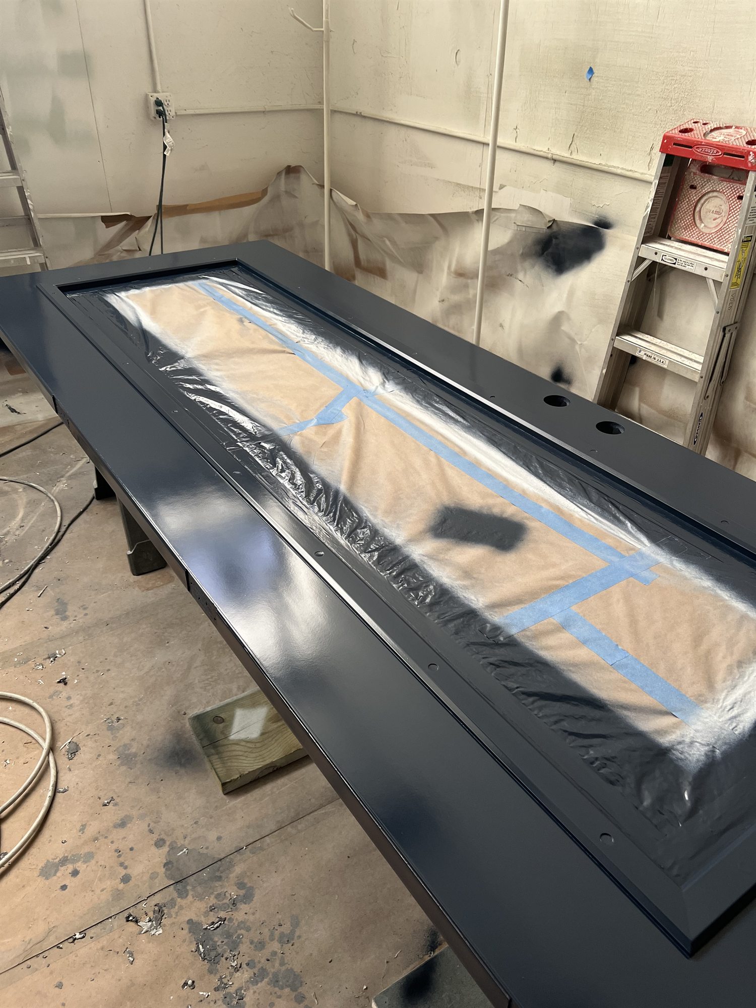 Exterior door sprayed navy in the shop